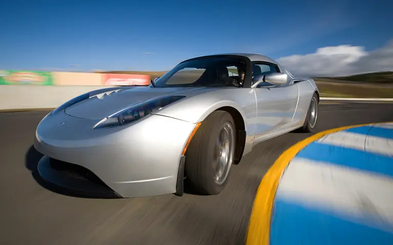 Silver 2008 Tesla Roadster cornering on a race track (Tesla Motors photo)
