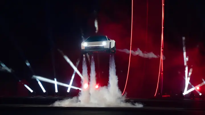 Slide from Tesla's Q3 2026 update: the Roadster hovering on its thrusters under lasers