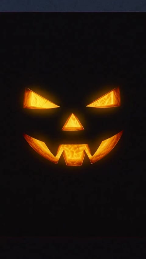 Glowing jack-o'-lantern face from Tesla's 'Halloween is coming' teaser video