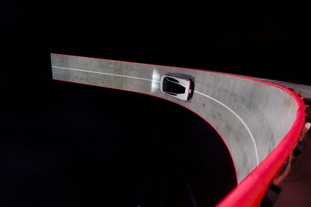 Tesla Roadster. Night demo: overhead of the car on the loop track