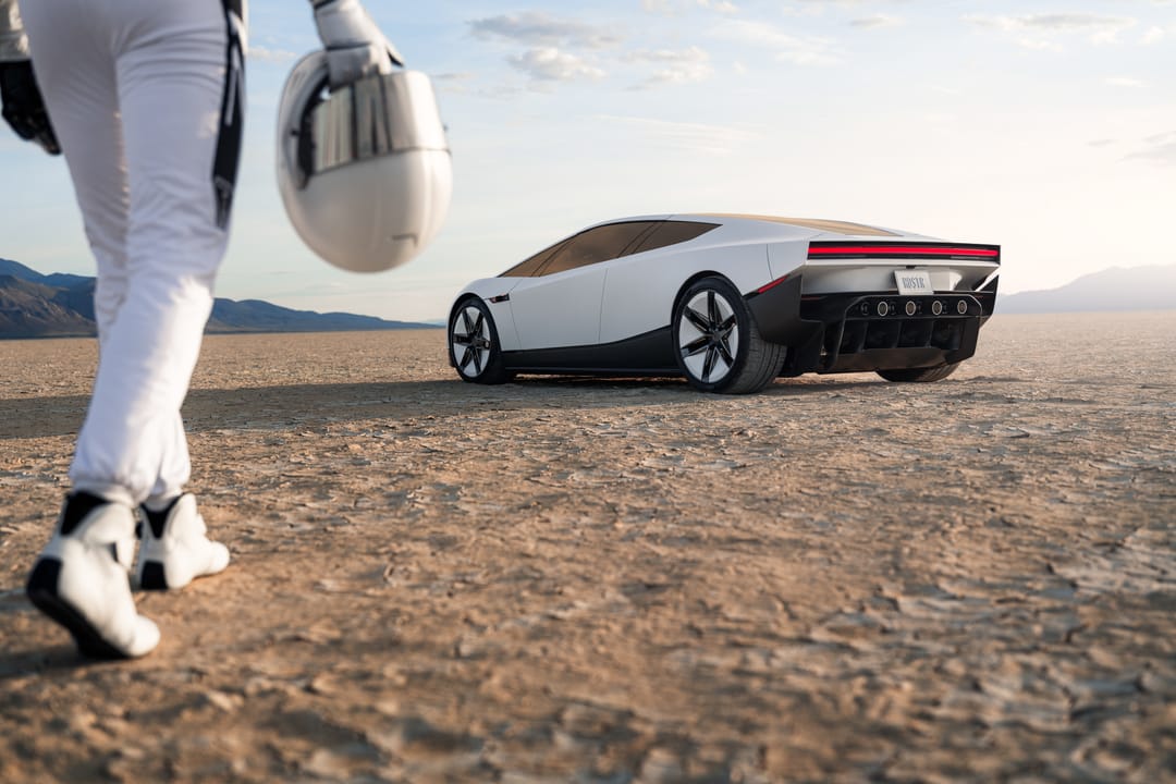 Tesla Roadster. Desert day, side three-quarter with astronaut