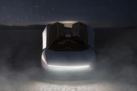 Tesla Roadster at night in the desert, doors up (Tesla photo)