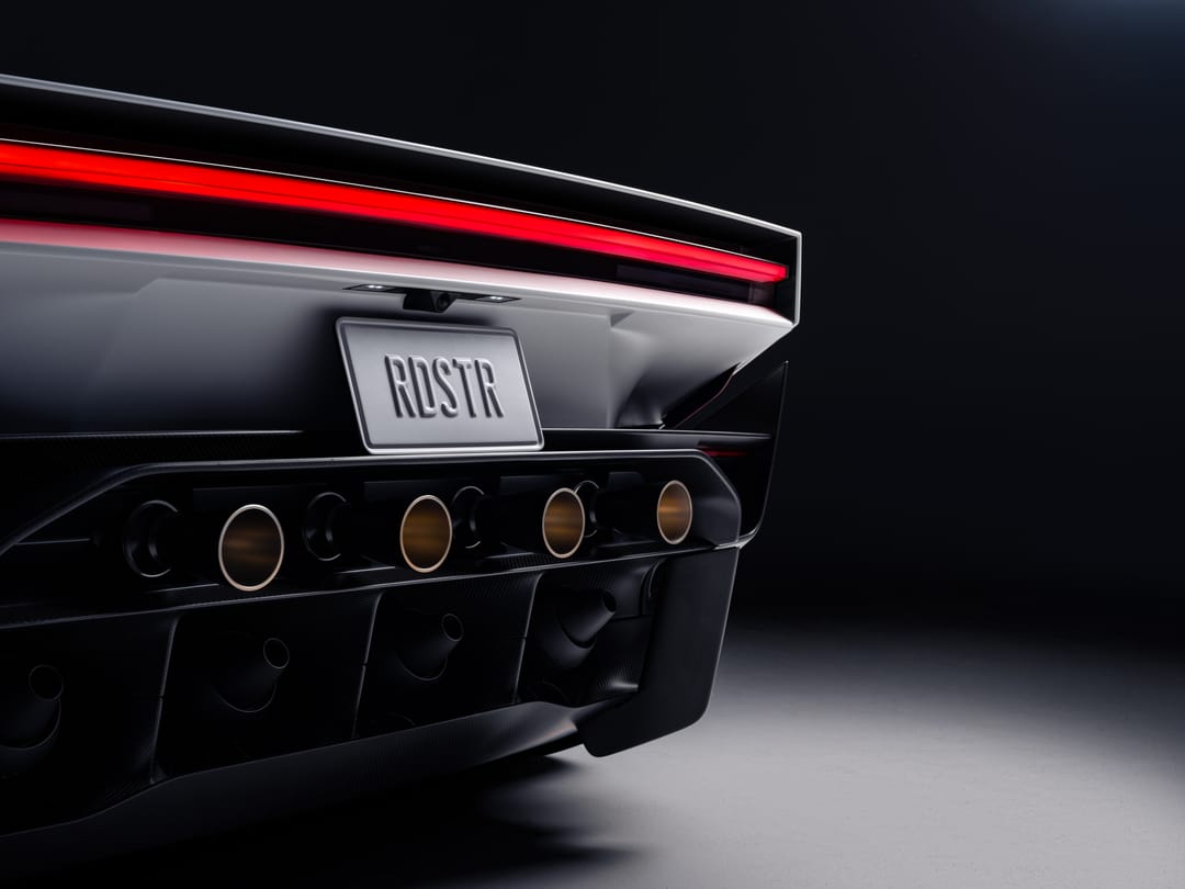 Roadster rear with RDSTR plate and gold-ringed ports below the full-length taillight