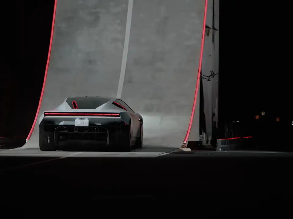 Tesla Roadster at the foot of the curved ramp, from Tesla's official video